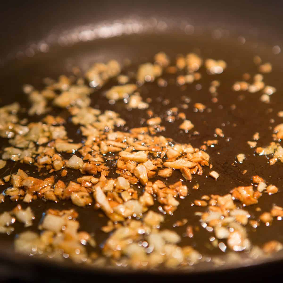 Browned sauteed garlic in a pan
