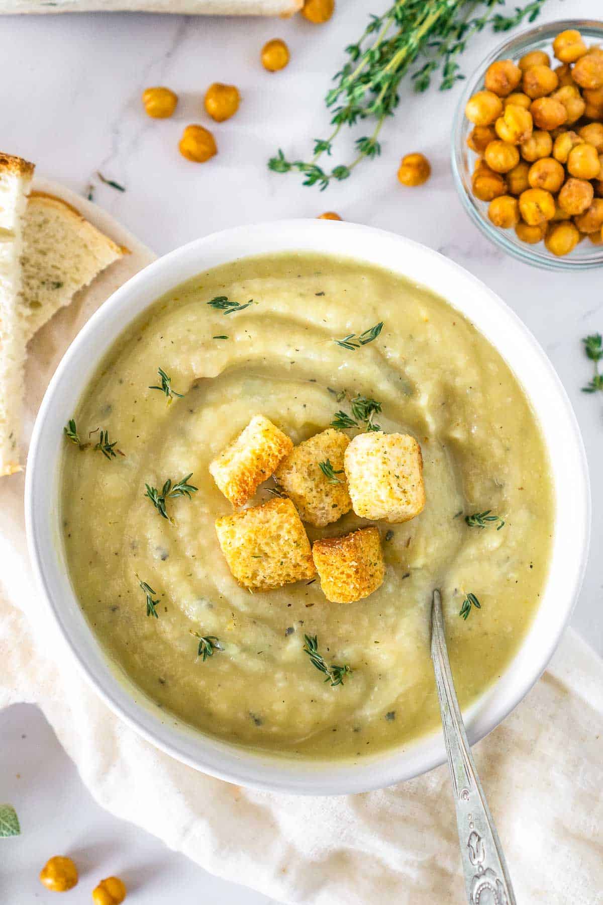 Bowl of vegan parsnip soup topped with croutons.