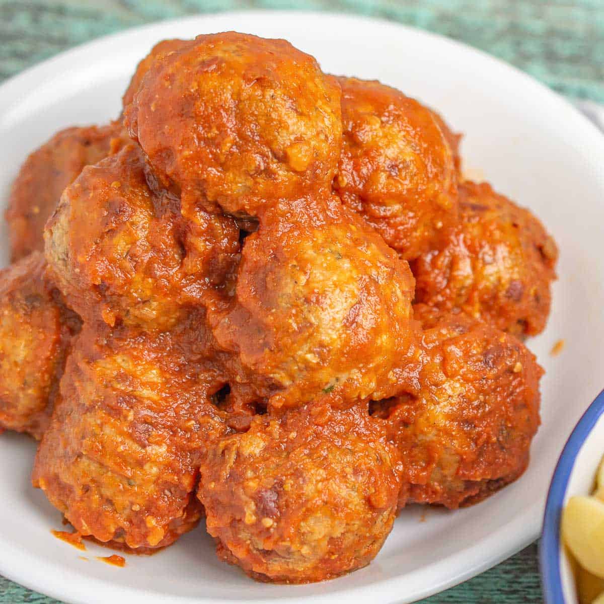 Stack of meatless vegan meatballs in sauce