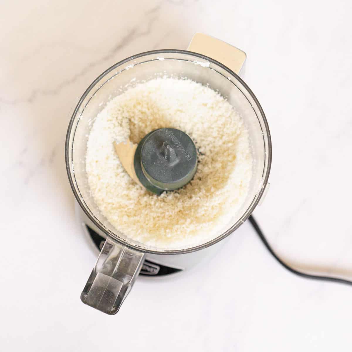 Shredded coconut in a food processor