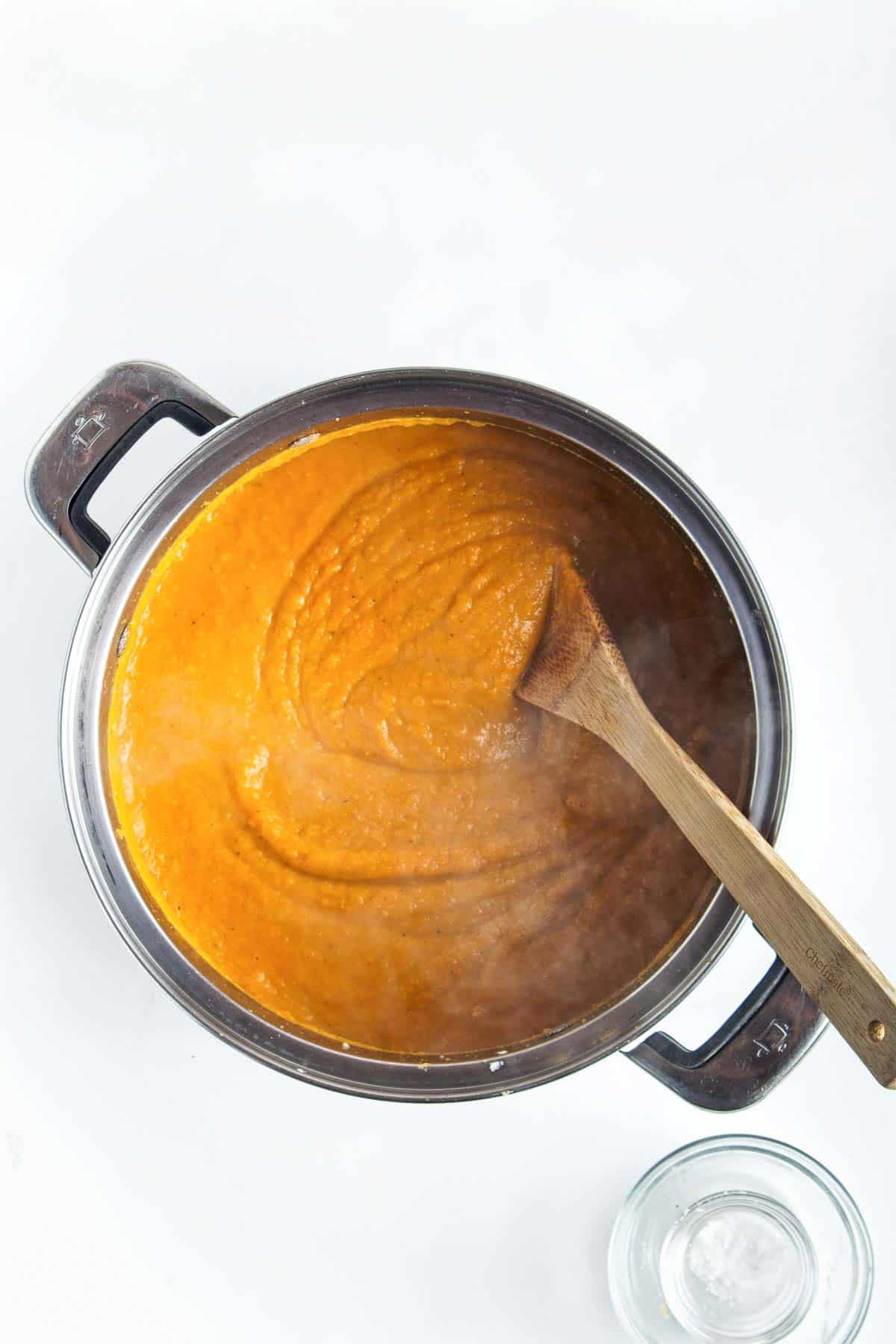 Pureed sweet potato soup in a pot.
