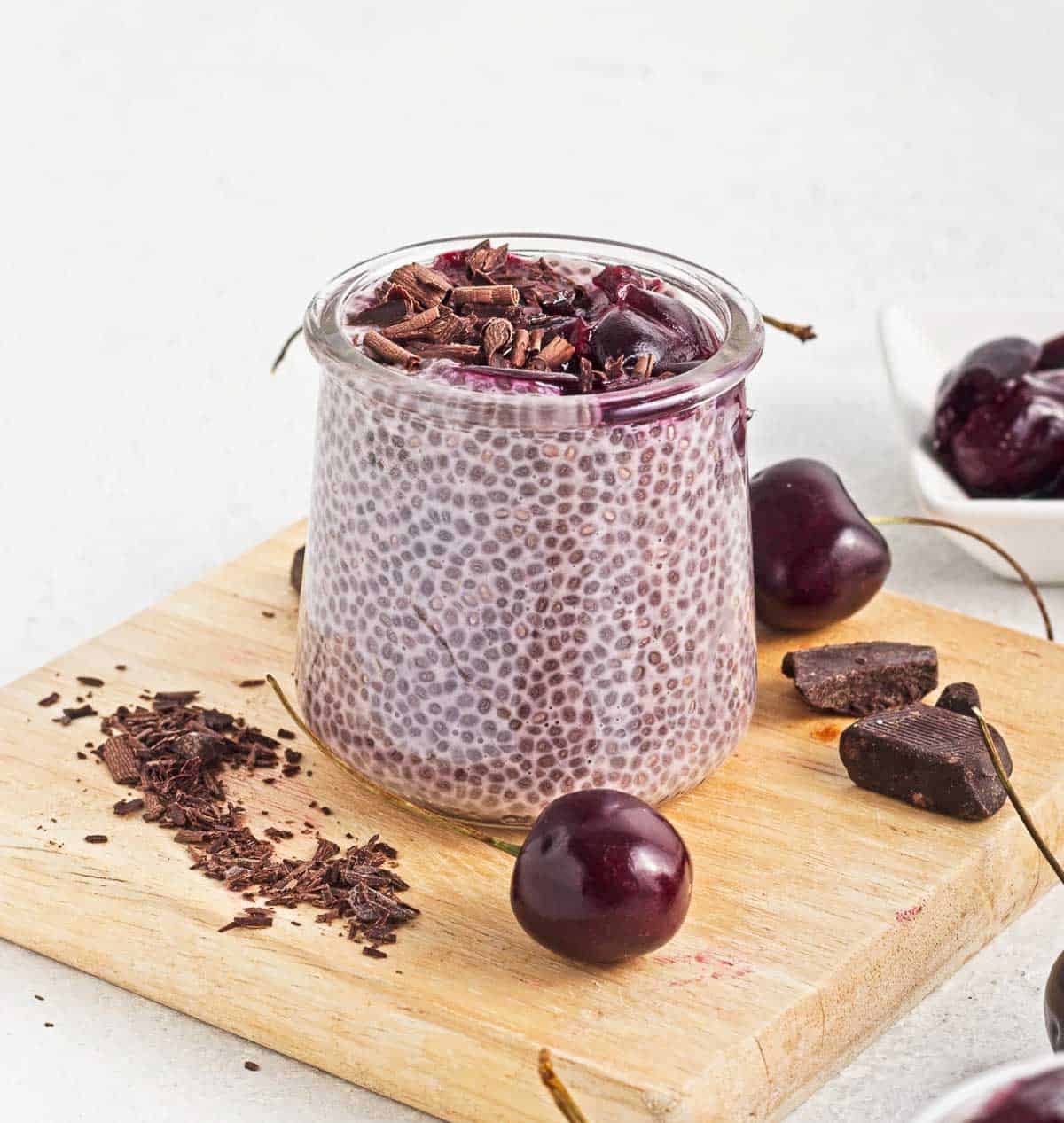Jar of of vegan cherry chia pudding with cherry compote