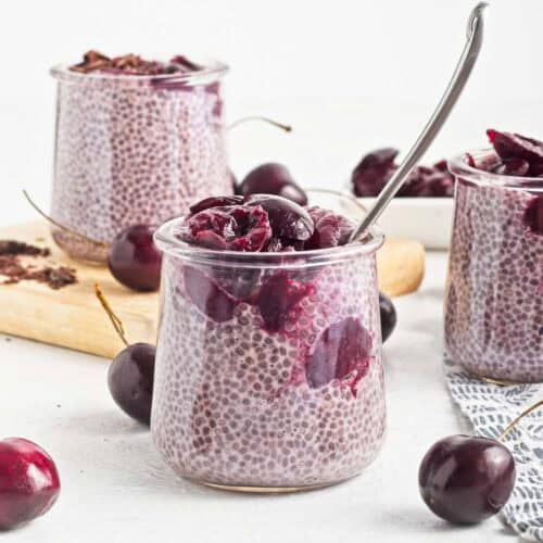 Jars of vegan cherry chia pudding with cherry compote