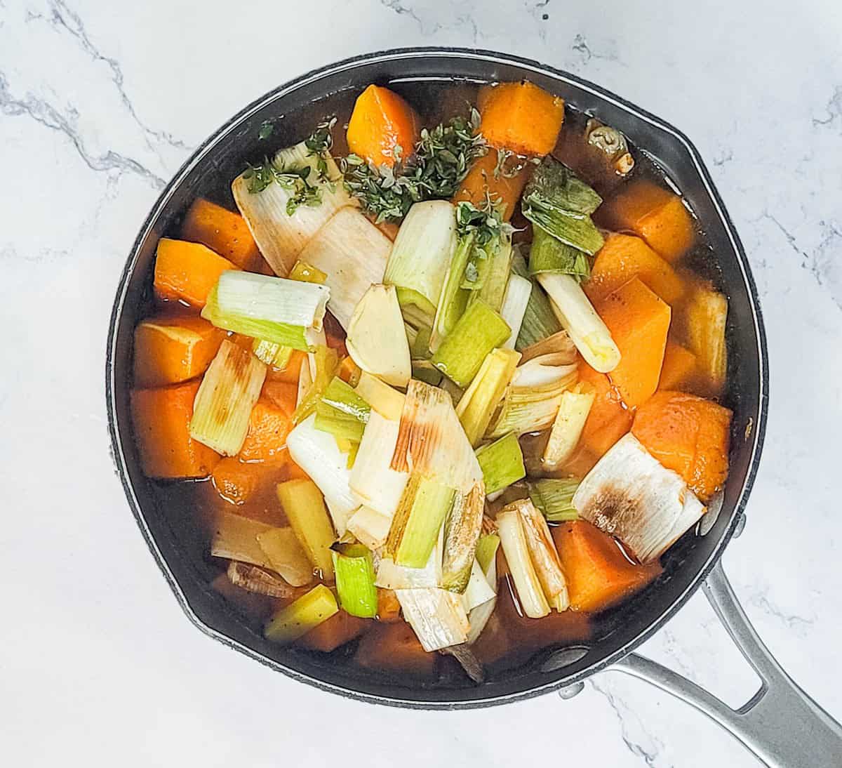 Pout of cubed butternut squash and roasted leeks