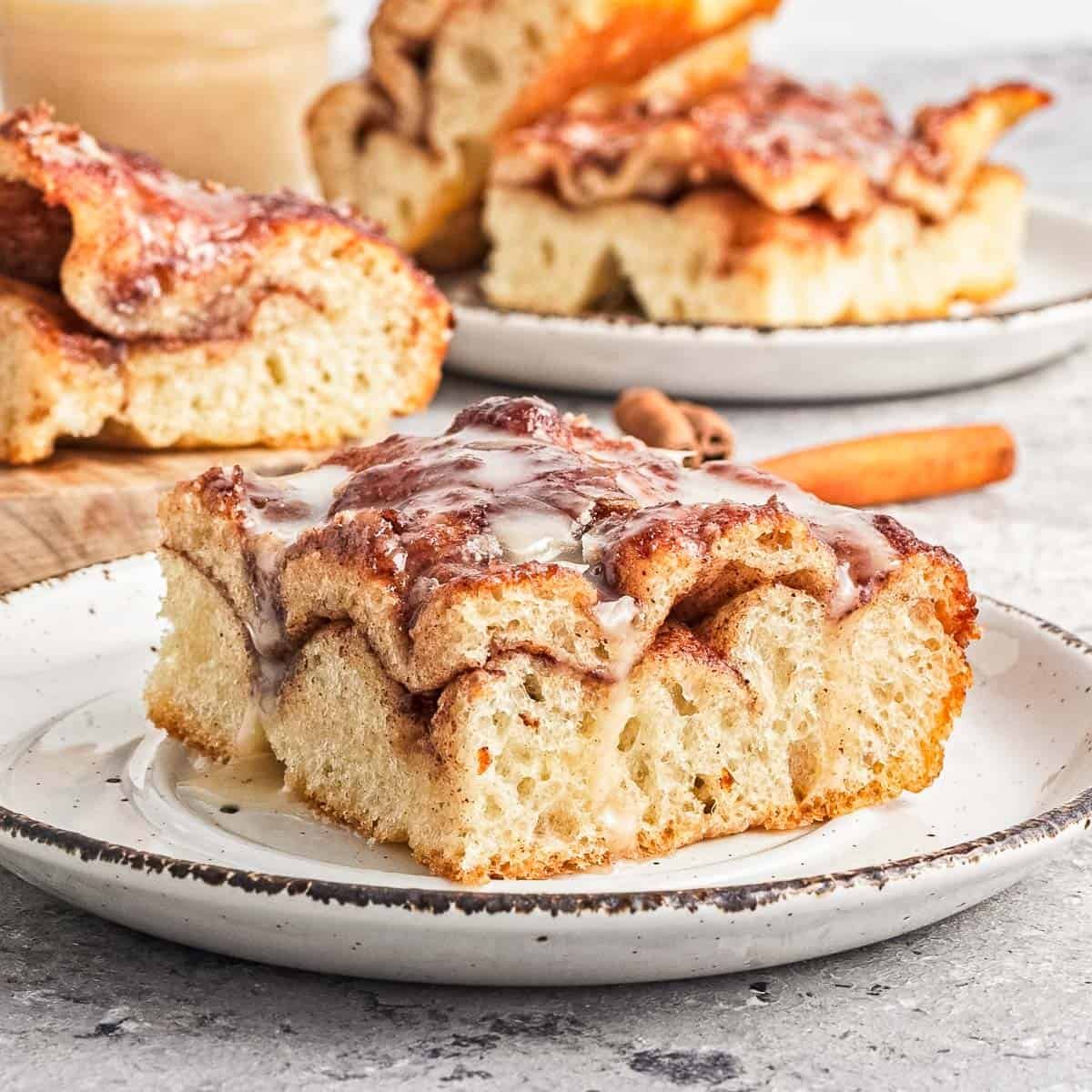 Slice of cinnamon roll focaccia bread on a plate