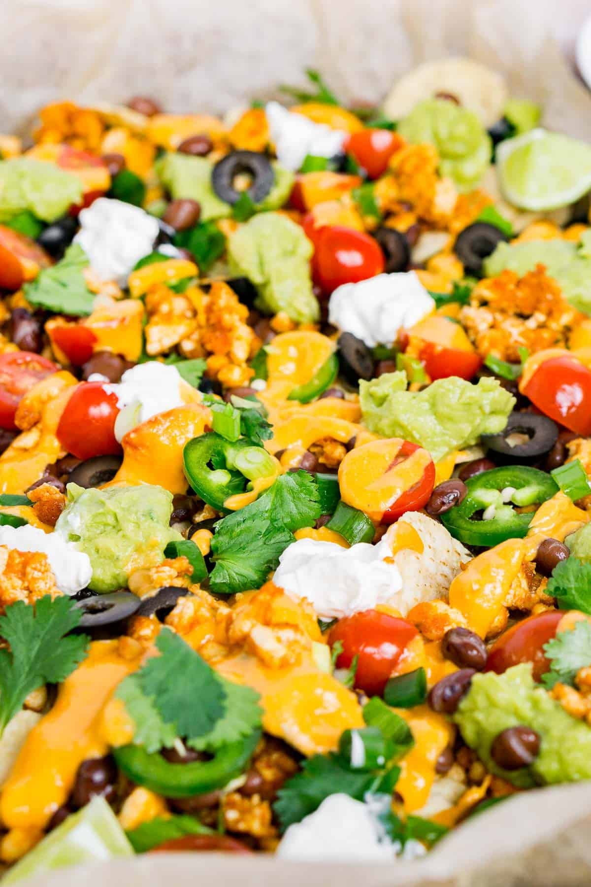 Close up of loaded vegan nachos to show texture